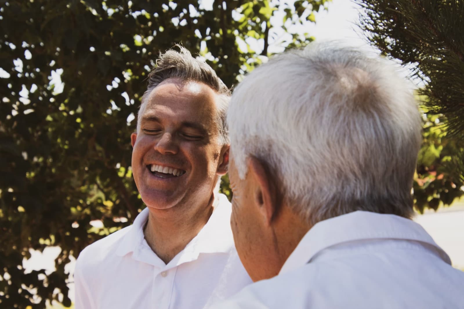 Two men talking outdoors as a symbol of retirement income planning.