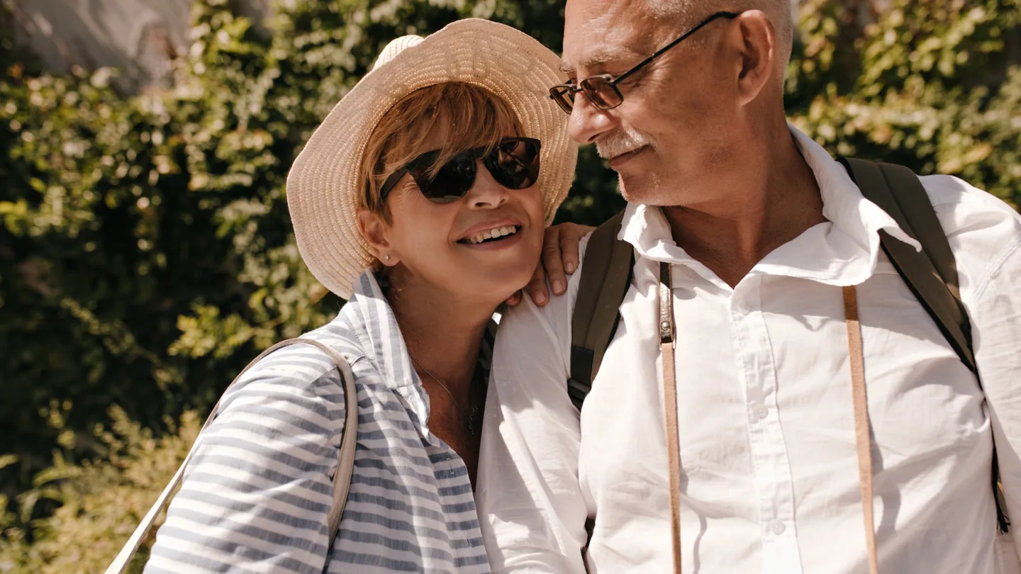 Retired couple discussing Texas TRS death benefits and survivor options.
