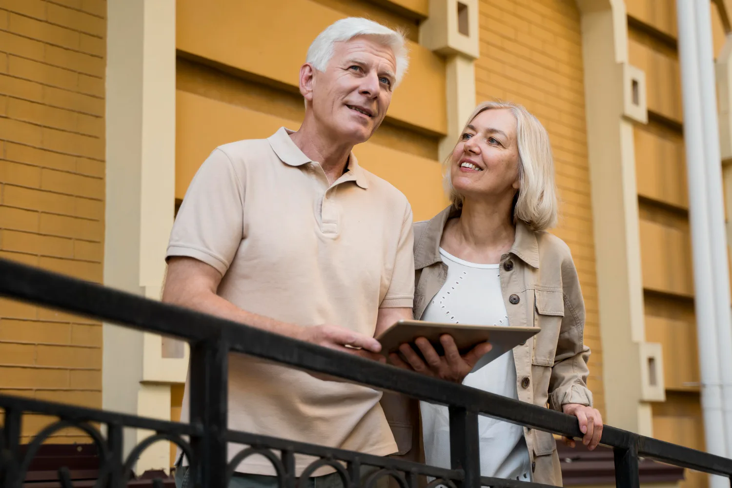 Older couple reviewing Social Security tax planning information on a tablet.