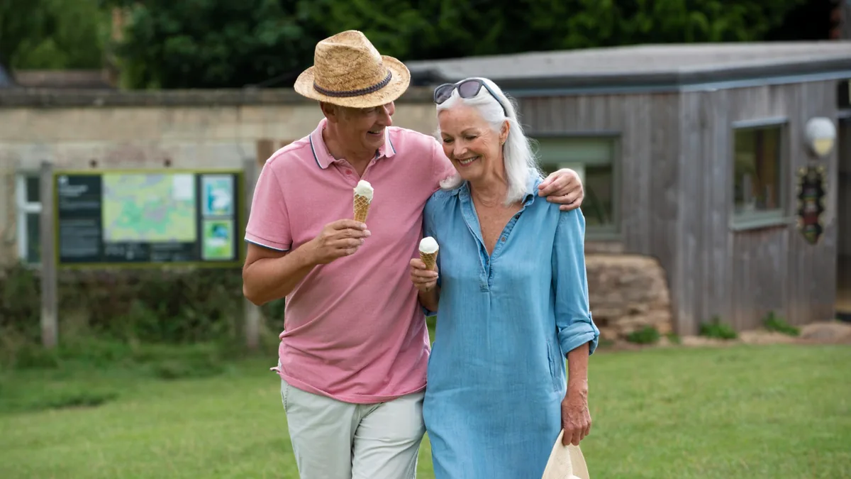 Retired couple walking together while planning how a Texas TRS lump sum may fit their retirement.
